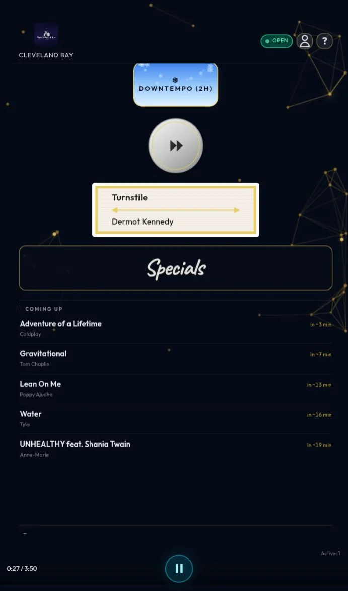Stylish Ambience venue player on a tablet in portrait orientation, showing now playing and playback controls